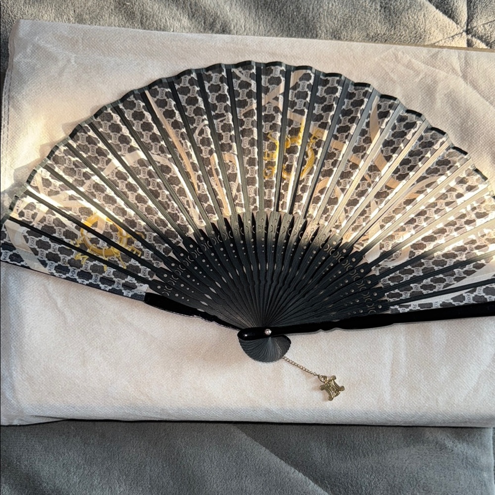 Preloved Celene fan Collection black excellent condition comes with pouch.